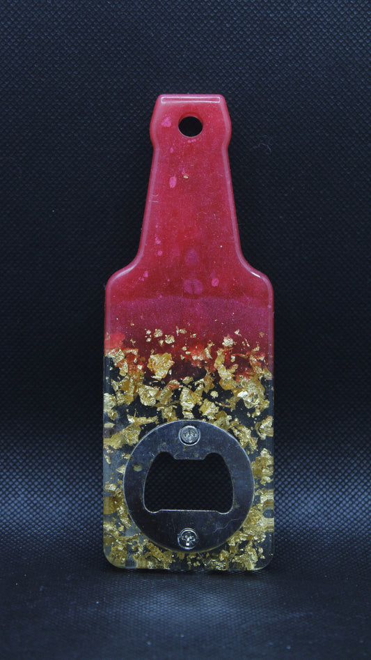 Décapsuleur bouteille rouge avec feuilles d'or